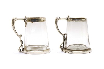Lot 25 - A pair of Victorian silver mounted glass mugs