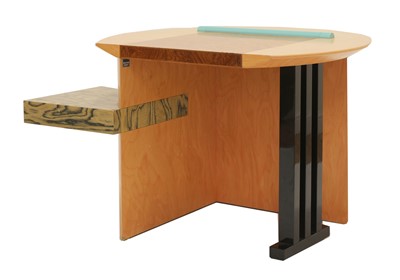 Lot 634 - A 'Sophia' maple veneered and lacquered desk