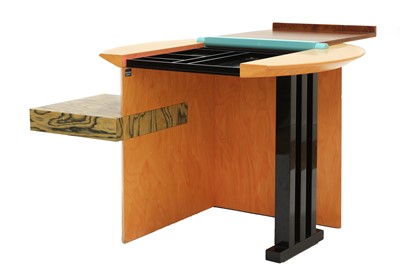 Lot 634 - A 'Sophia' maple veneered and lacquered desk
