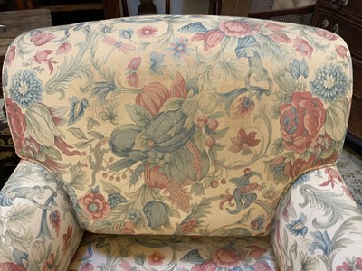 Lot 540 - A pair of Howard-style armchairs by George Smith