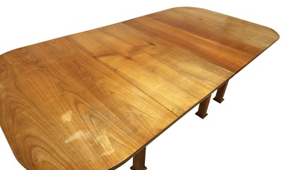 Lot 234 - An extending cherrywood dining table