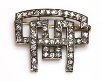 Lot 165 - An Art Deco diamond set monogram brooch