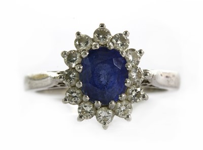 Lot 252 - A platinum sapphire and diamond cluster ring