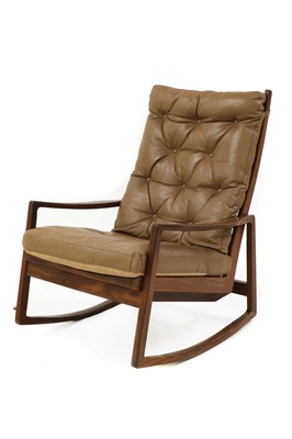 Lot 432 - A teak rocking chair