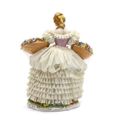 Lot 238 - A Dresden Sitzendorf porcelain lace figurine of a flower seller