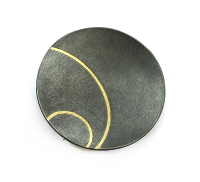 Lot 110 - A sterling silver and 18ct gold 'Lunar' brooch, by Hannah Souter