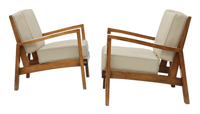 Lot 629 - A pair of teak lounge chairs