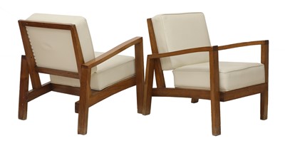 Lot 629 - A pair of teak lounge chairs