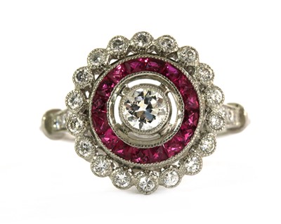 Lot 199 - A diamond and ruby target cluster ring.