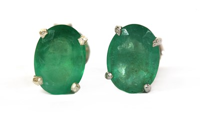 Lot 231 - A pair of silver single stone emerald stud earrings