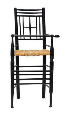 Lot 128 - An ebonised child's high chair