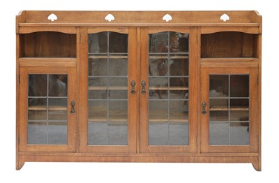Lot 168 - An Arts and Crafts glazed oak bookcase