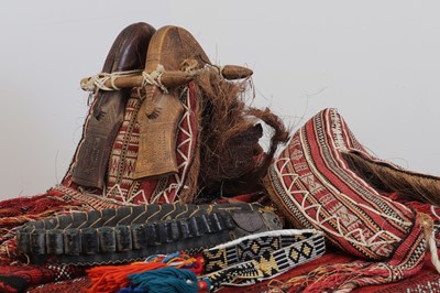 Lot 723 - A small collection of Omani camel harnesses and accessories