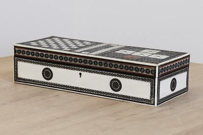 Lot 584 - An Anglo-Indian ivory-inlaid travelling games box