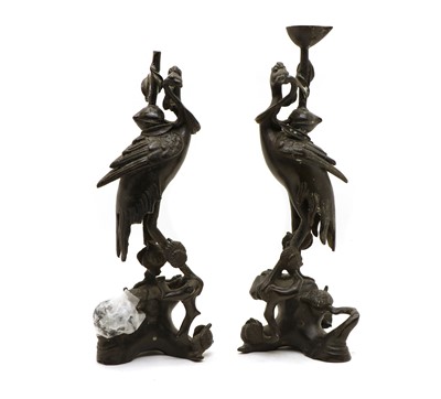 Lot 120 - A pair of Chinese bronze candlesticks