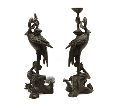 Lot 120 - A pair of Chinese bronze candlesticks