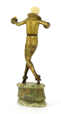 Lot 254 - An Art Deco cold-painted bronze and ivory figure of an harlequin