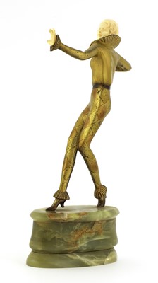 Lot 254 - An Art Deco cold-painted bronze and ivory figure of an harlequin