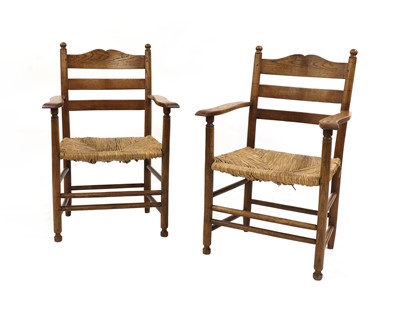 Lot 148 - A pair of Gordon Russell oak armchairs