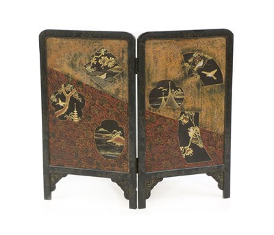Lot 507 - A lacquered and gilt wooden folding screen