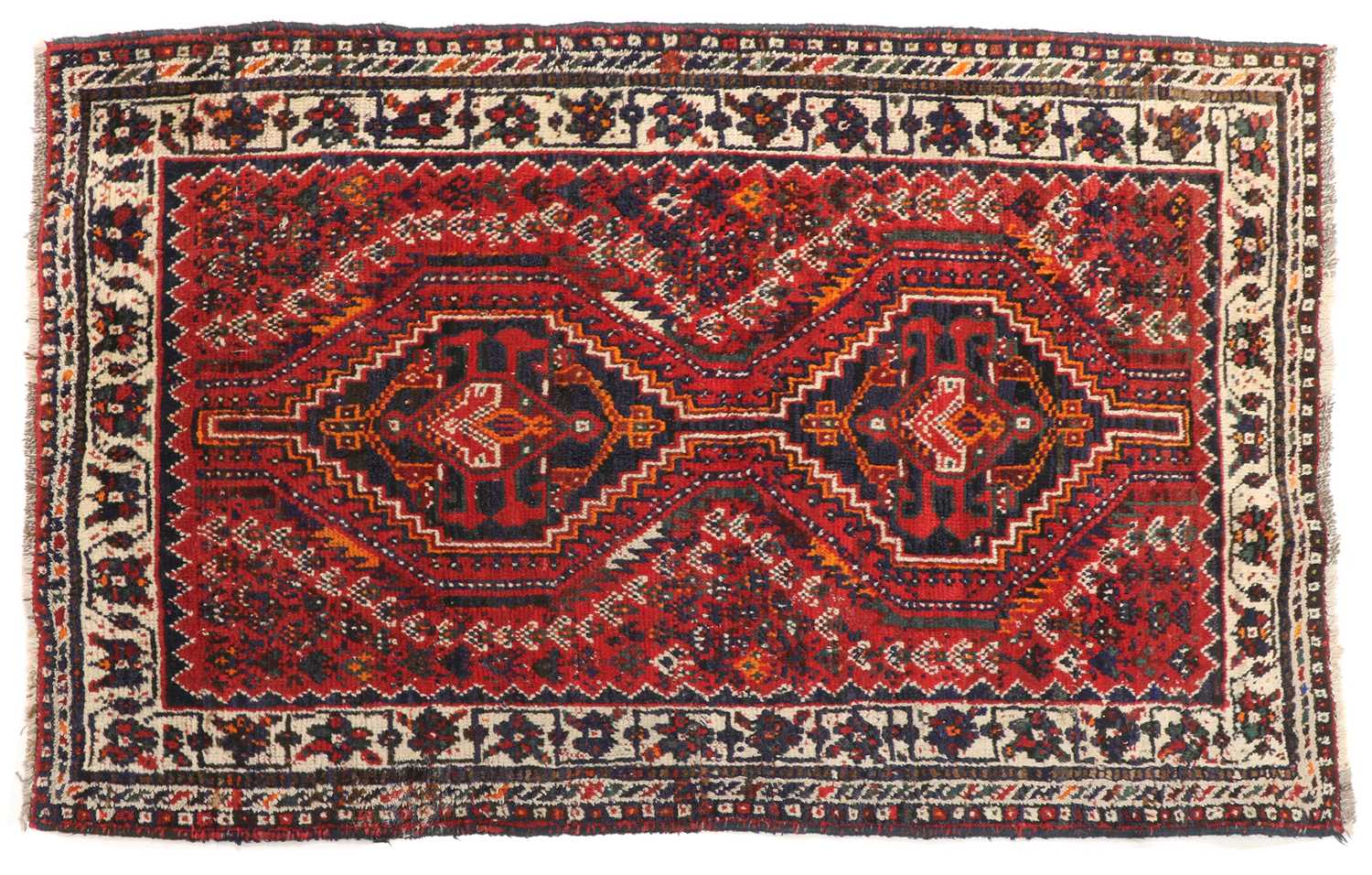 Lot 369 - A small tribal wool rug