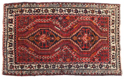 Lot 369A - A small tribal wool rug
