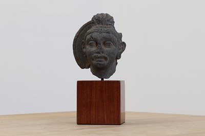 Lot 754 - A carved schist fragmentary head of a bodhisattva