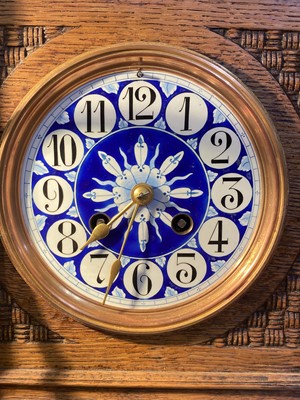 Lot 126 - An Aesthetic Movement oak mantel clock