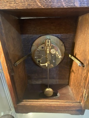 Lot 126 - An Aesthetic Movement oak mantel clock