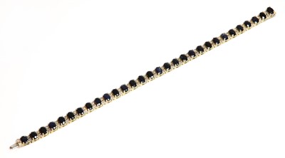 Lot 360 - A Continental sapphire and diamond line bracelet