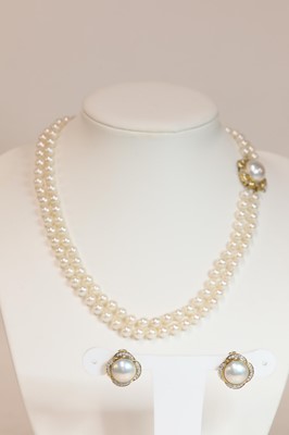 Lot 250 - A cultured pearl and diamond two row uniform necklace and matched earring suite