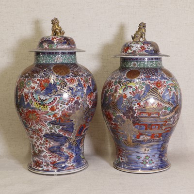 Lot 44 - Two Chinese clobbered blue and white vases and covers