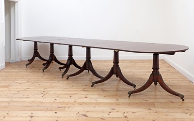 Lot 579 - A George III-style mahogany six-pillar dining table