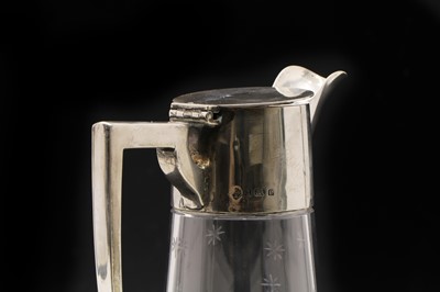Lot 2 - An Edwardian silver mounted and cut glass claret jug