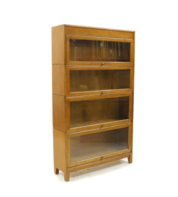 Lot 493 - A four-section oak modular bookcase