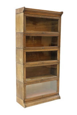 Lot 426 - An oak five section modular bookcase by Gunn