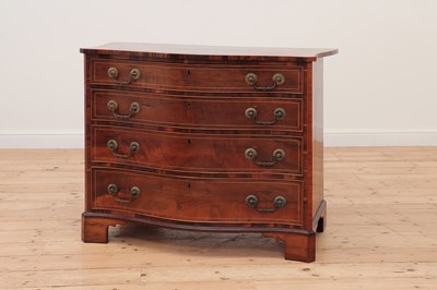 Lot 617 - A George III serpentine mahogany chest of drawers