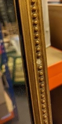 Lot 436 - A slender gilt framed wall mirror