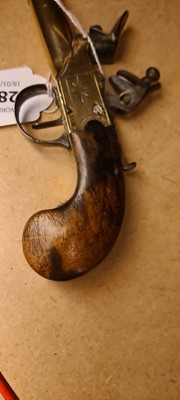 Lot 286 - A 19th century flintlock pocket pistol