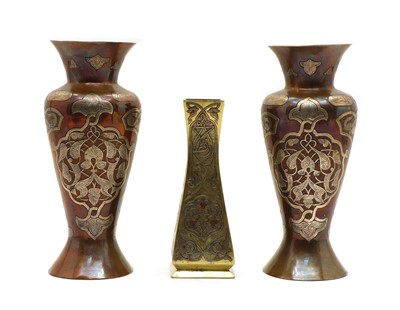 Lot 124 - A pair of copper and silver-inlay Damascene vases