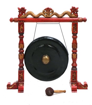 Lot 457 - A Chinese red lacquer gong stand and clapper