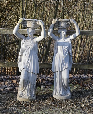 Lot 531 - A pair of composite stone garden statues
