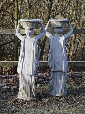 Lot 531 - A pair of composite stone garden statues