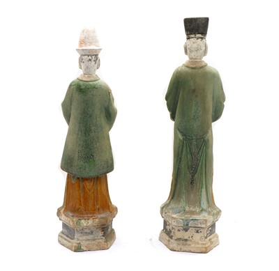 Lot 301 - A pair of Tang or Ming Dynasty style sancai-glazed pottery tomb figures