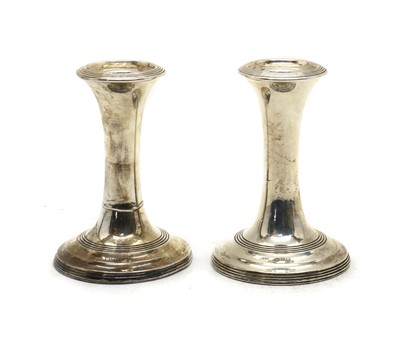 Lot 42 - A pair of Edwardian silver dwarf candlesticks