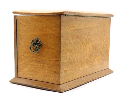 Lot 260 - An Edwardian honey oak stationery cabinet