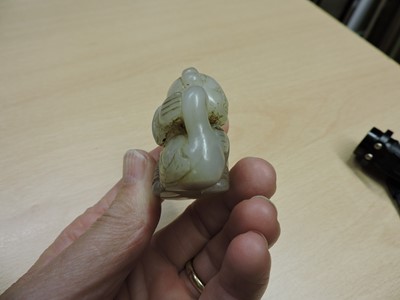Lot 142 - A Chinese jade carving of a boy with a goose