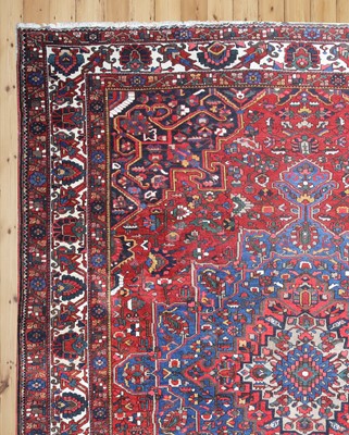 Lot 626 - A Persian Heriz wool carpet