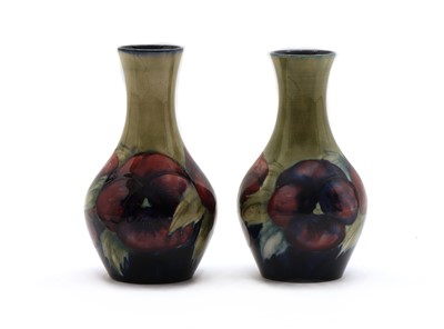 Lot 50 - A pair of Moorcroft pottery ‘Pansy’ pattern vases