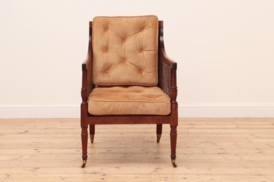 Lot 622 - A George III mahogany bergère library chair